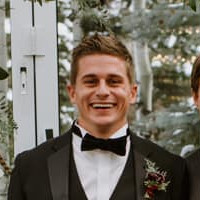 Chase Slappey smiling after getting our graphic design services