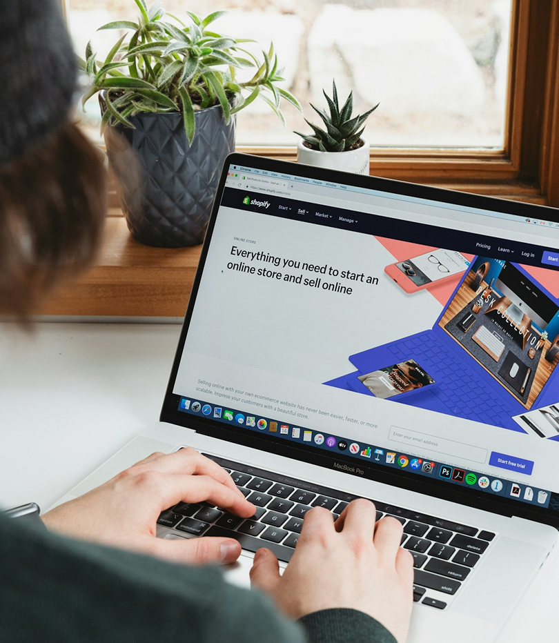 a person typing on a laptop showing affordable digital marketing that works