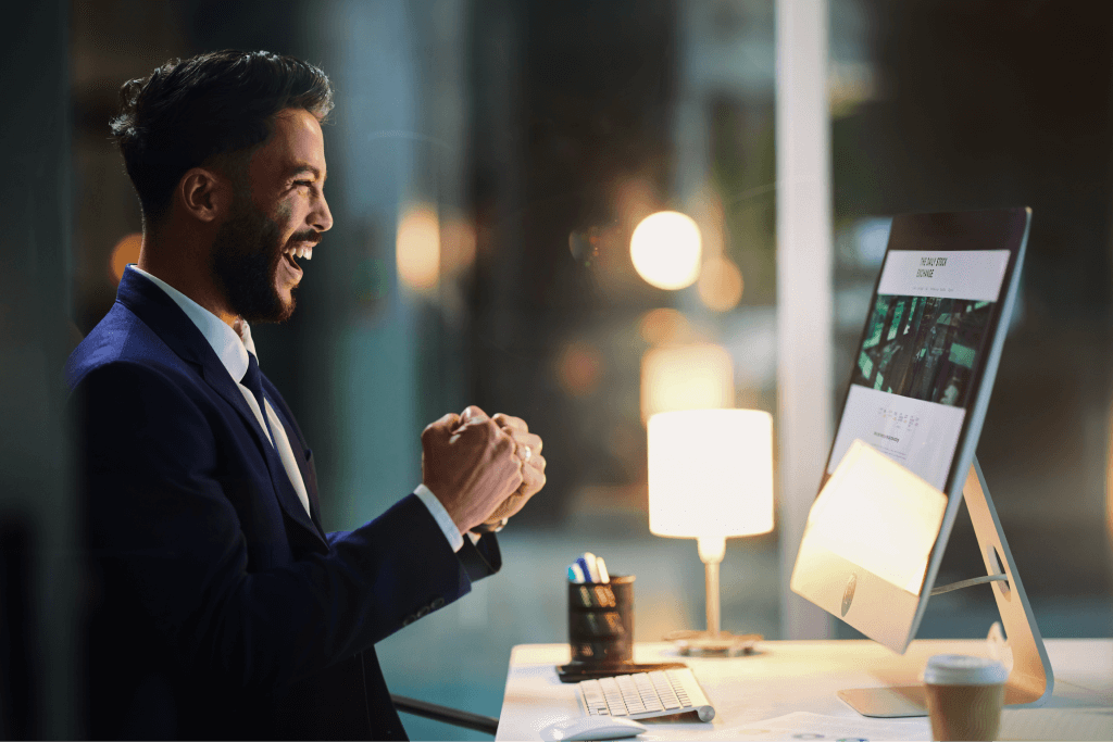 a business man happy after our ui/ux design services